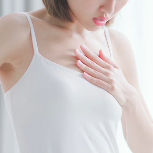 Woman clutching chest
