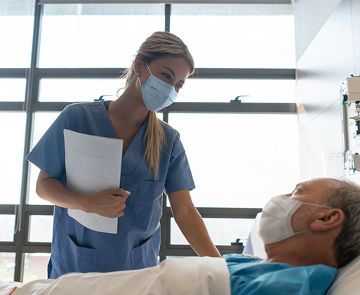 A nurse speaking with a patient