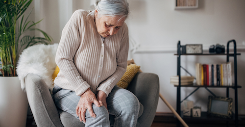 Woman clutching her knee