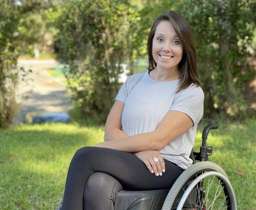 Sarah Kelly in a wheelchair