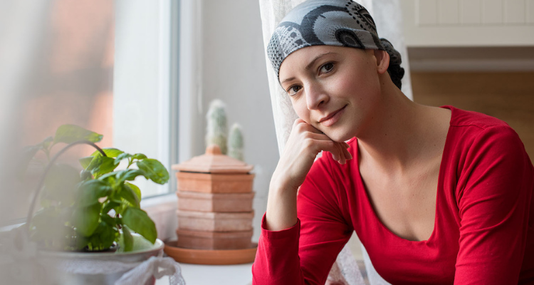 A woman sitting by the windowsill