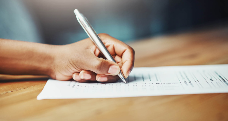 A hand writing on paper