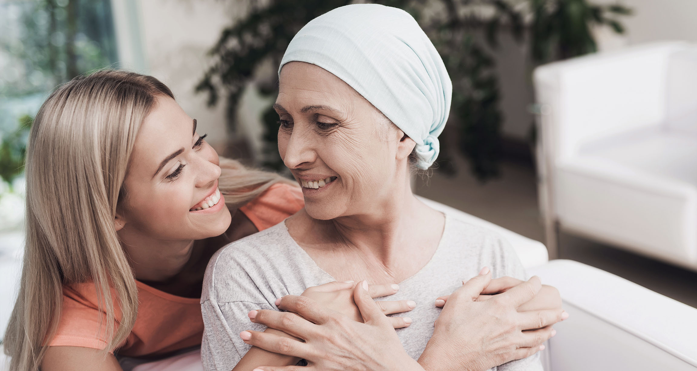 two women smiling at eachother