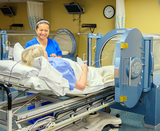 A nurse checking a patient in bed
