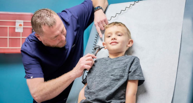 Doctor checking pediatric patient
