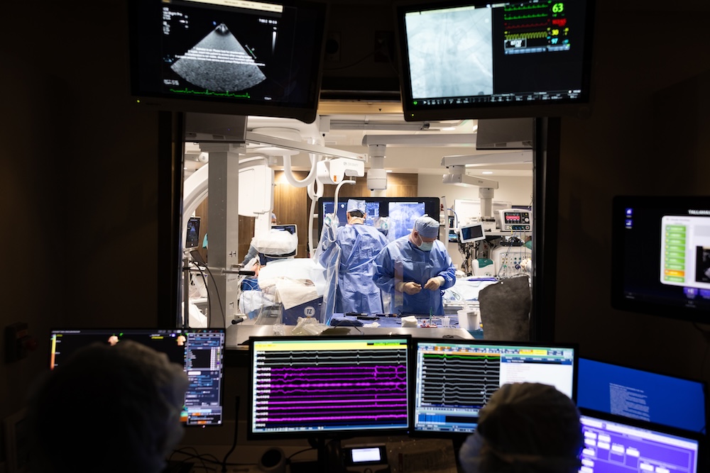 dark room with heart monitoring screens