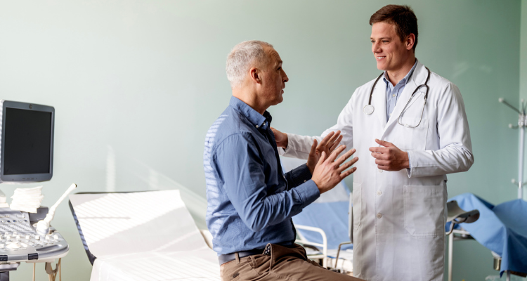 doctor talking to male patient