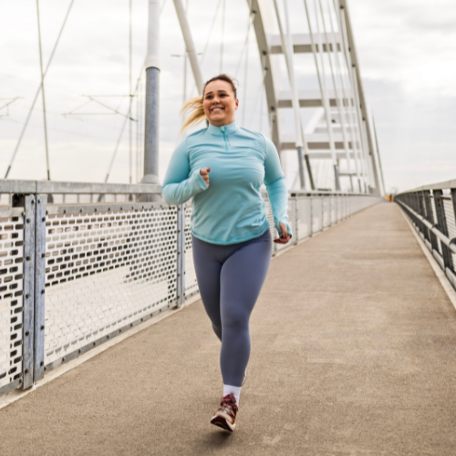 Woman running on a bridge