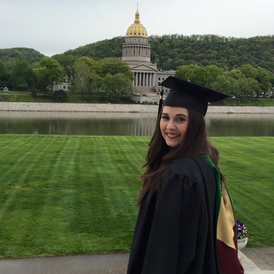 Megan Bell poses outside post graduation 