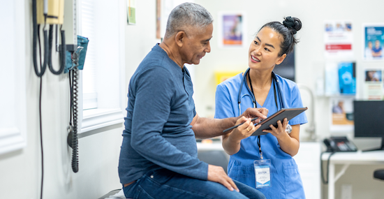 Man at doctors appointment speaking with his doctor