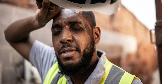 man sweating while working