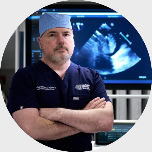 Dr. Dixon in front of a cardiac ultrasound