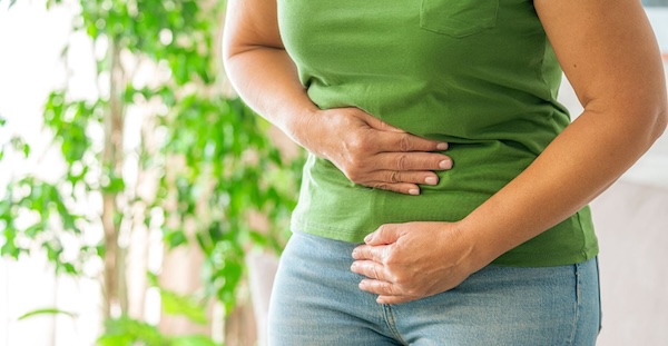Woman clutching her stomach
