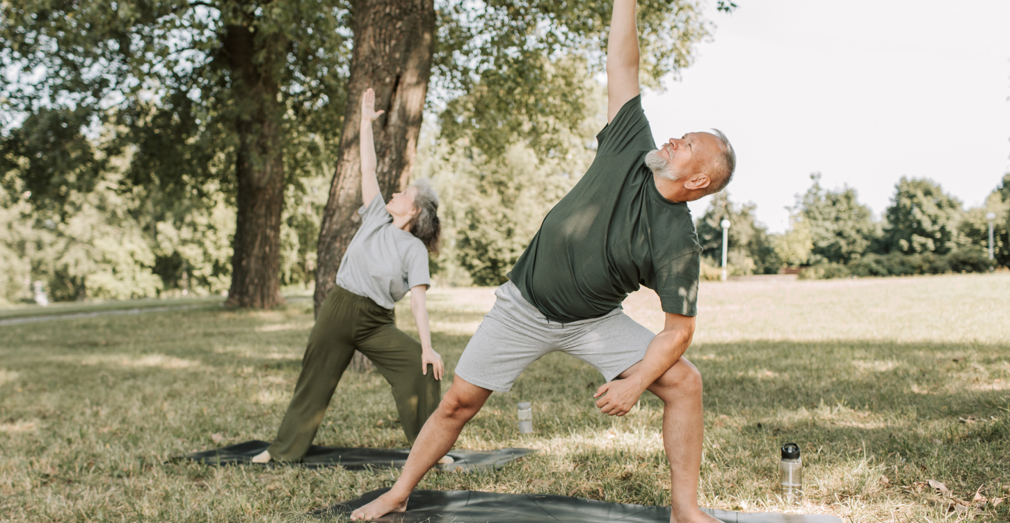 older couple doing yoga