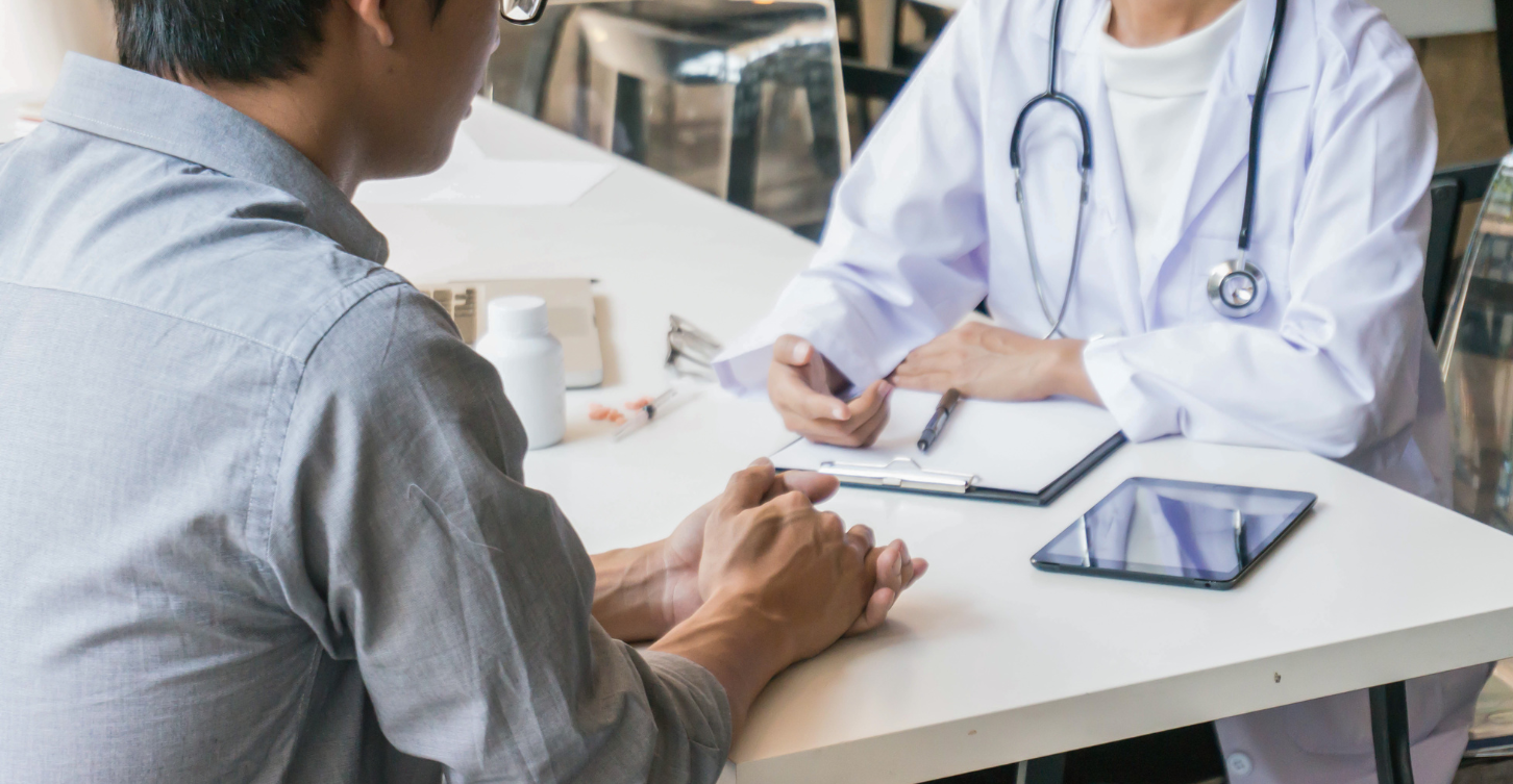 Man talking to doctor