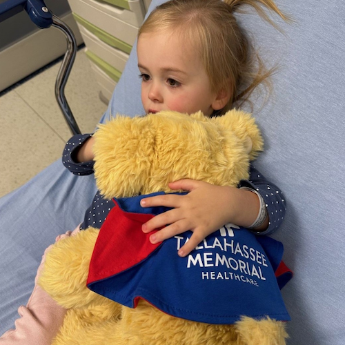 Lilly hugging Superpup