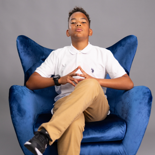 Cooper sitting in blue chair