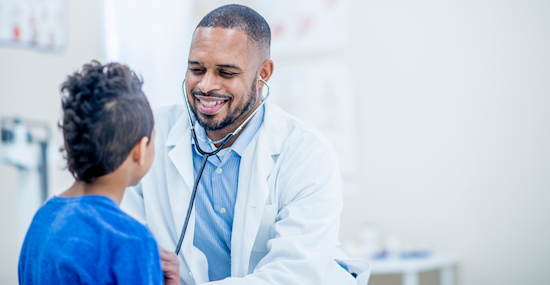 Doctor talking to child patient