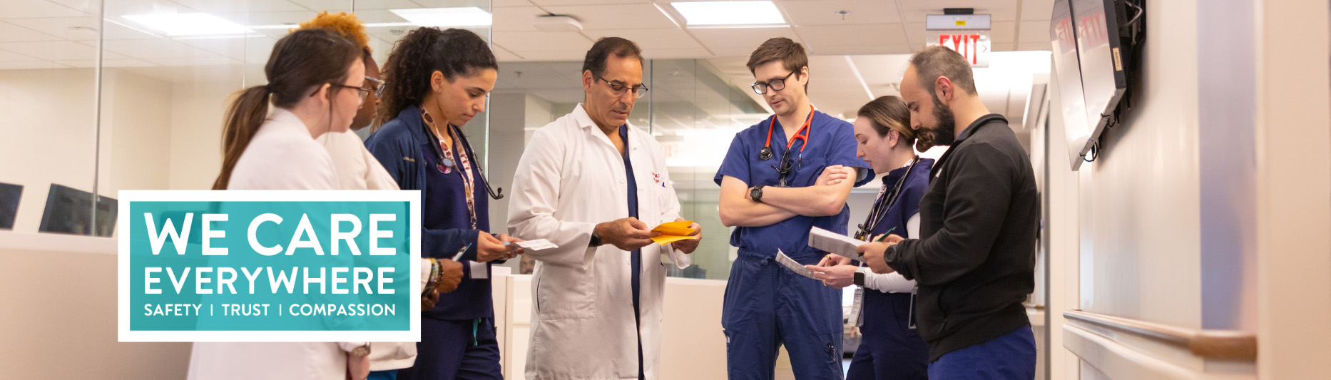 We Care Everywhere - doctors consulting in the hallway