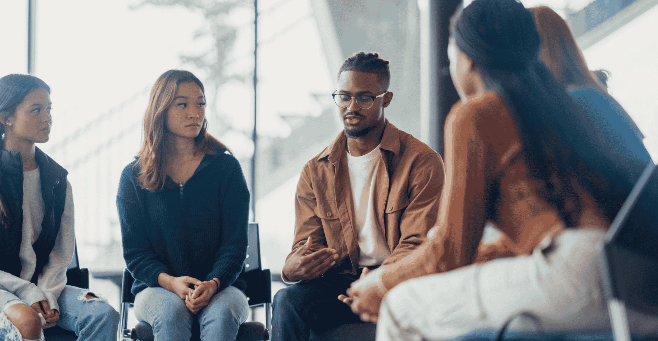 Man speaking in group therapy