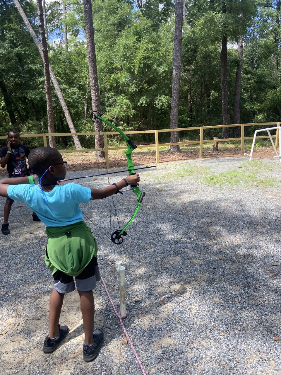 A camper practices archery during Florida Diabetes Camp.