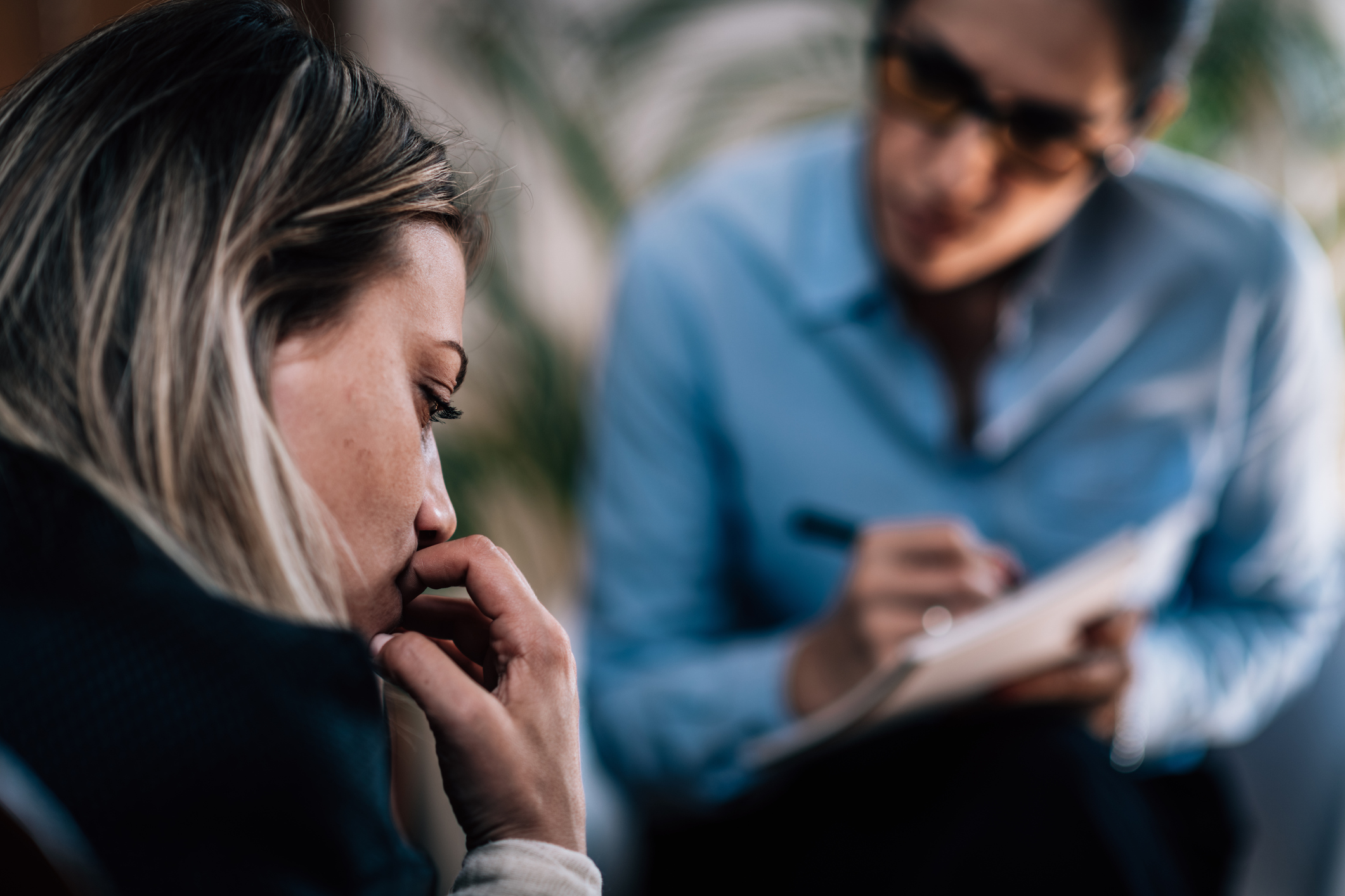 A woman speaking with a therapist