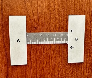 A ruler measuring a length Description automatically generated with medium confidence