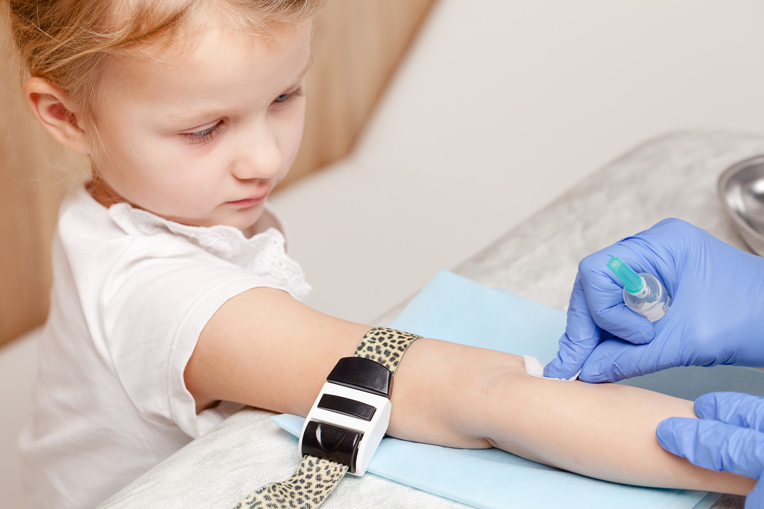 A little girl about to get her blood drawn
