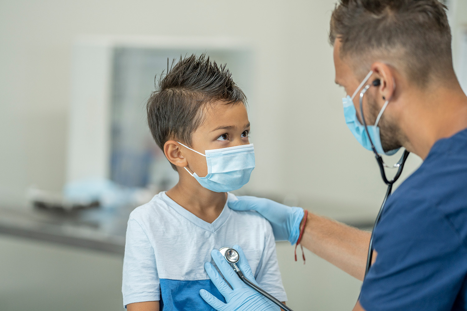 A young boy getting his heart rate checked