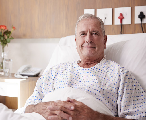 An older patient in his bed