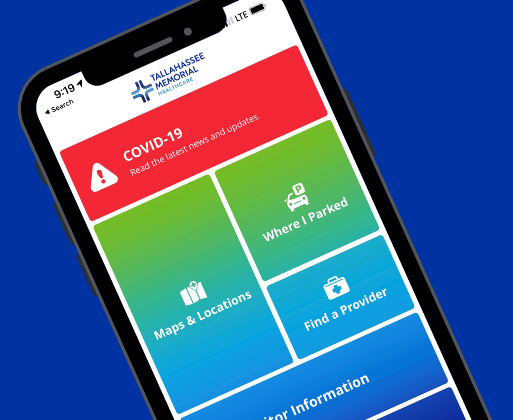 A smartphone showing the TMH website
