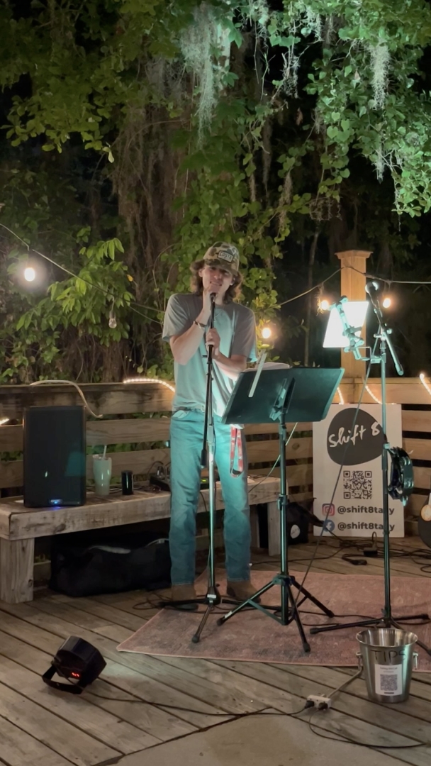 Owen singing on stage
