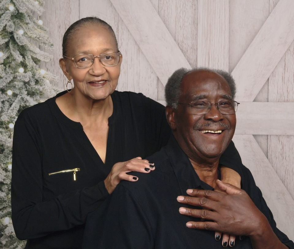 Eddie and his wife pose for holiday photos